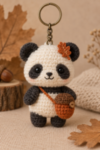 Finished original autumn panda crochet keychain with acorn pouch